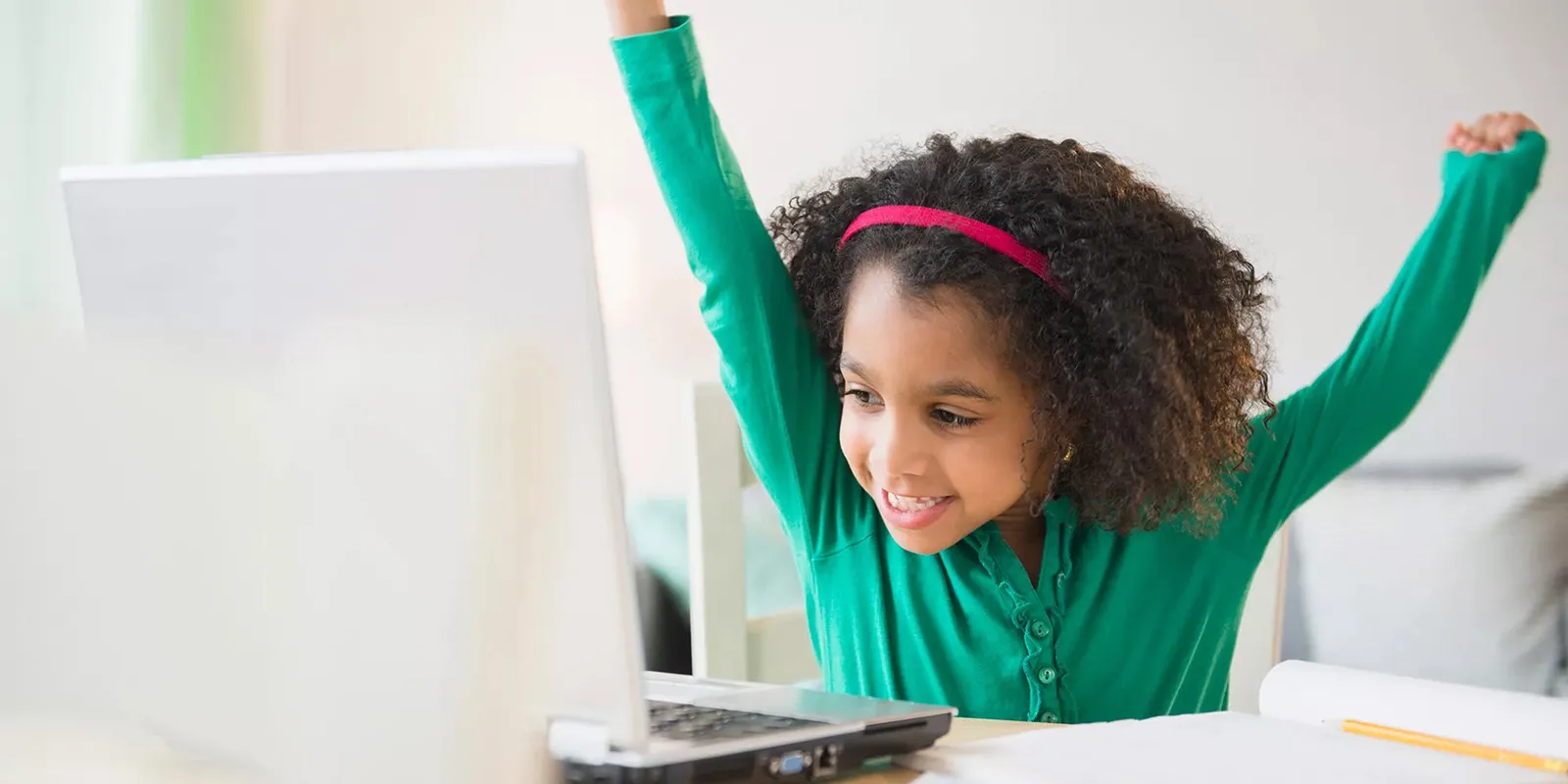 Excited girl at a computer