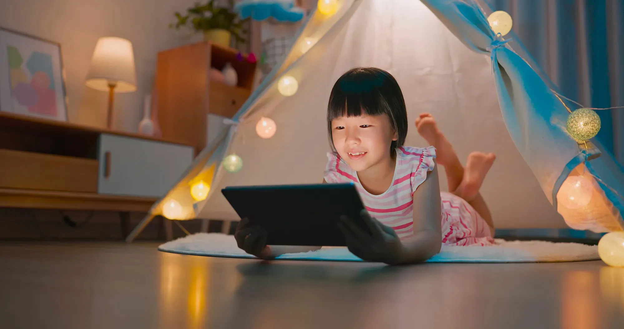 Girl reading on a tablet computer