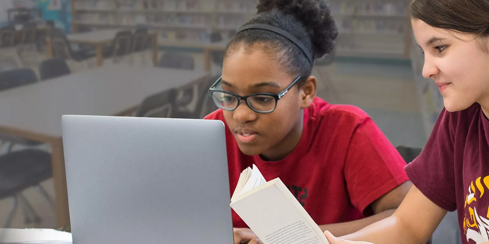 Two female students at a computer